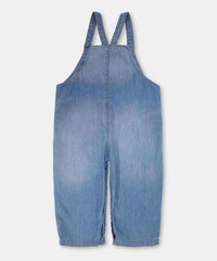 Enterizo denim bebé azul medio tirantes cruzados 12‑24 m