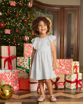 Vestido ojalillo crudo con espalda descubierta y moño