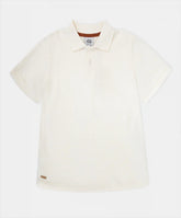 Camiseta tipo polo marfil niño talla 2T‑5T vista frontal