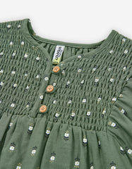 Detalle fruncido blusa Zippy flores verde oliva