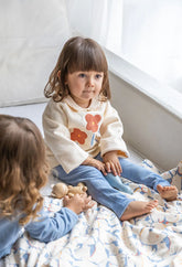 Conjunto bebé Boboli saco beige con flores y legging azul