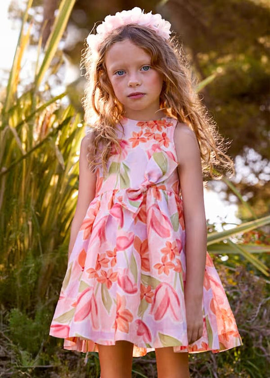 Vestido infantil rosa Mayoral con estampado floral y moño
