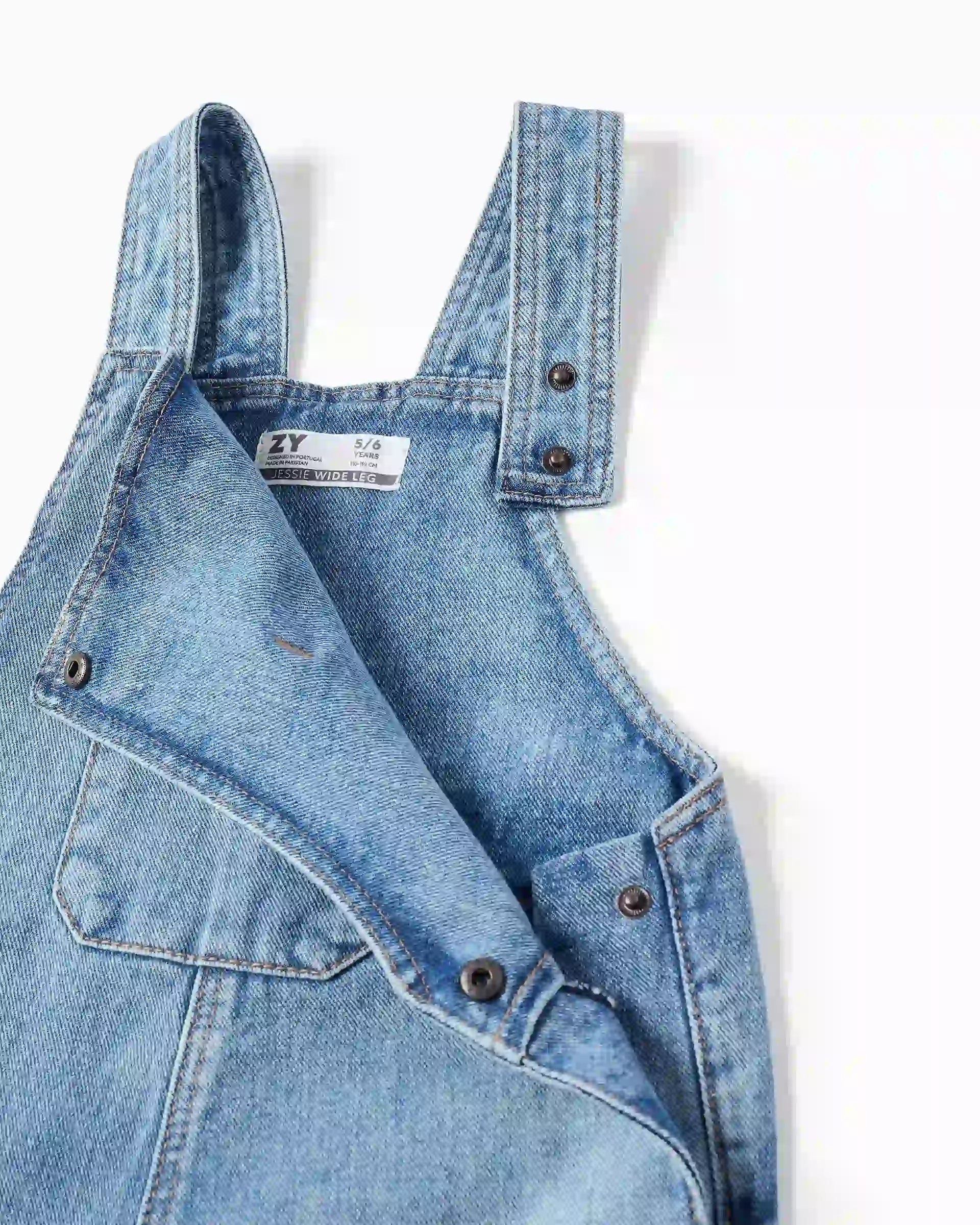 Braga Bolsillos Flecos Denim Zippy detalle