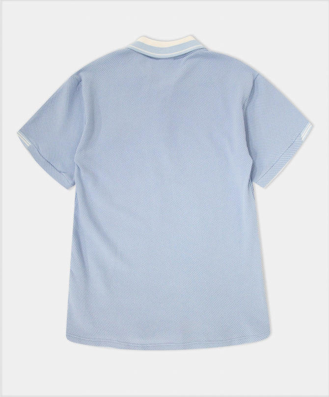 Camiseta deportiva polo azul claro para niño