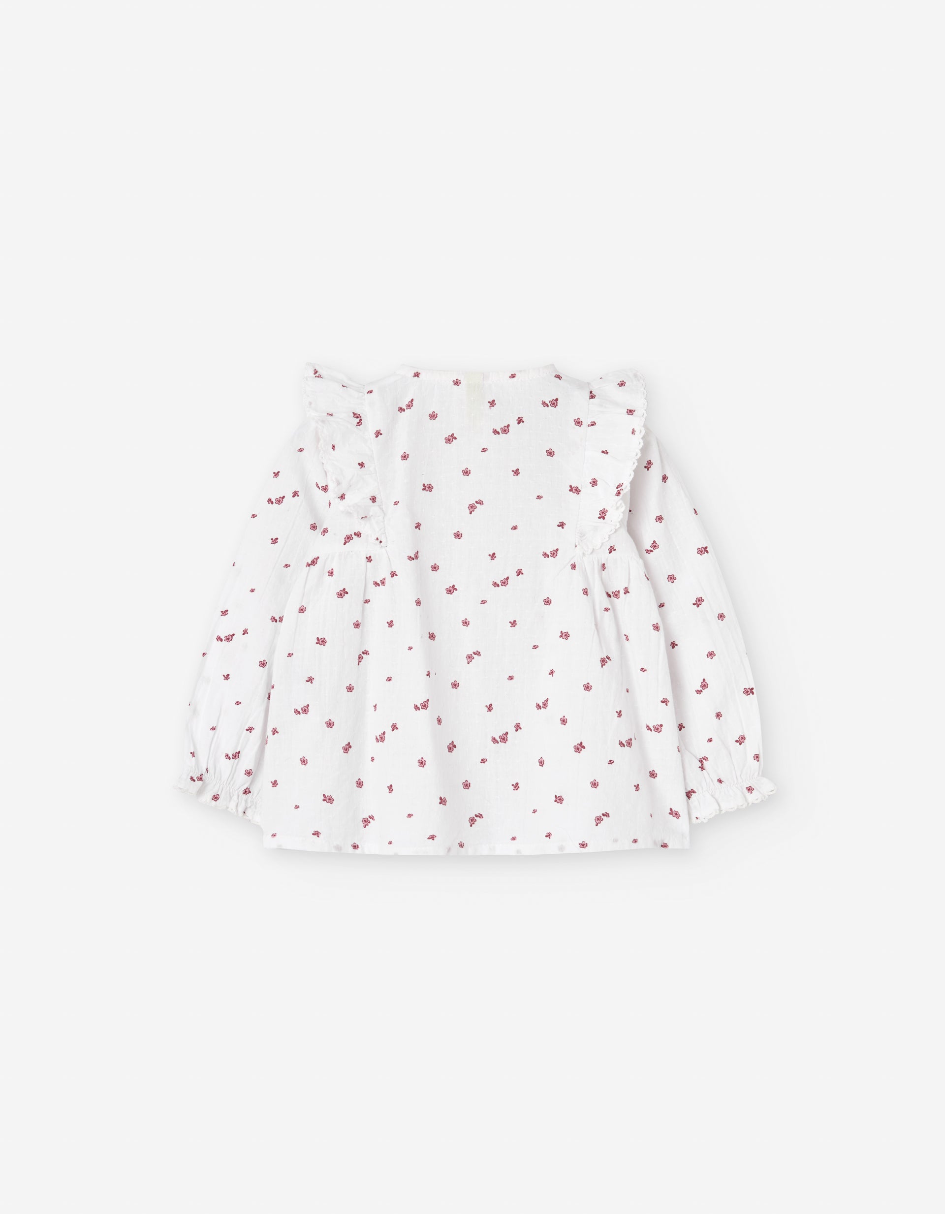 Parte trasera de blusa blanca con estampado floral