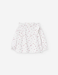 Parte trasera de blusa blanca con estampado floral