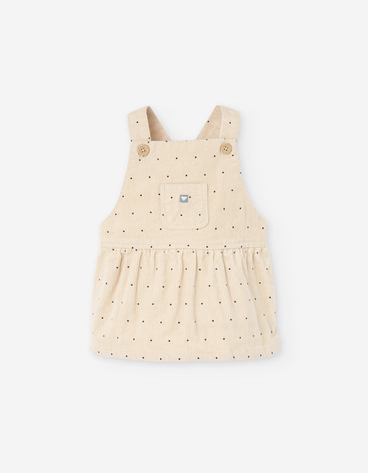 Braga de pana beige para bebé niña con puntos y bolsillo frontal