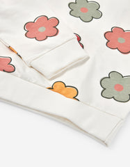 Detalle flores multicolor saco con capucha Zippy
