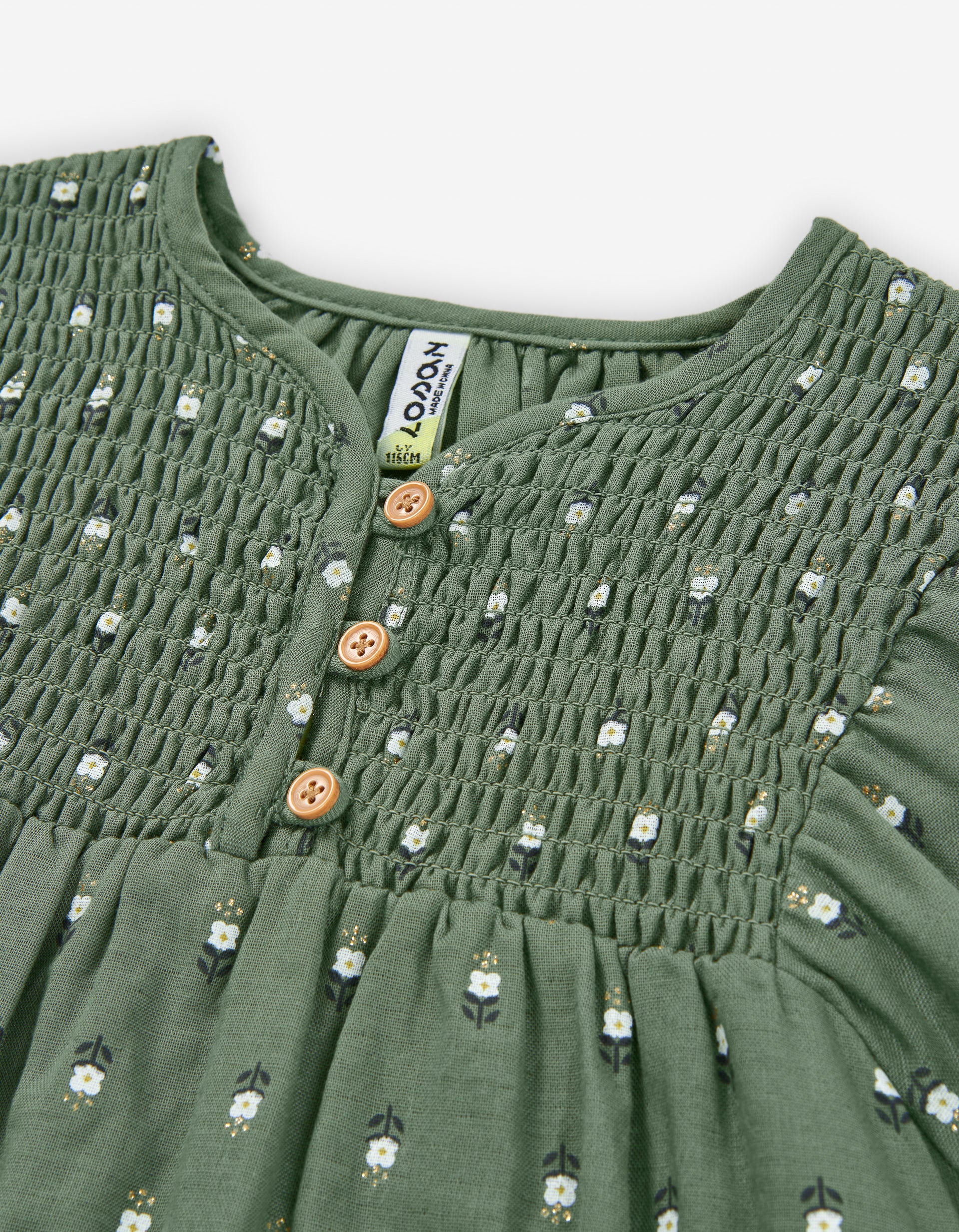 Detalle fruncido blusa Zippy flores verde oliva