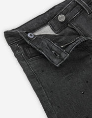 Detalle cinturilla y cierre con botón y cremallera