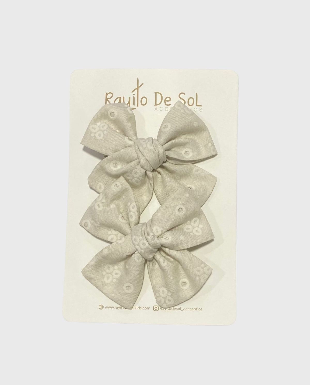 Set 2 Pinzas Moño Beige Ojalillo Rayito de Sol
