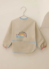 Babero Manga Larga Caracol Beige Mayoral modelo